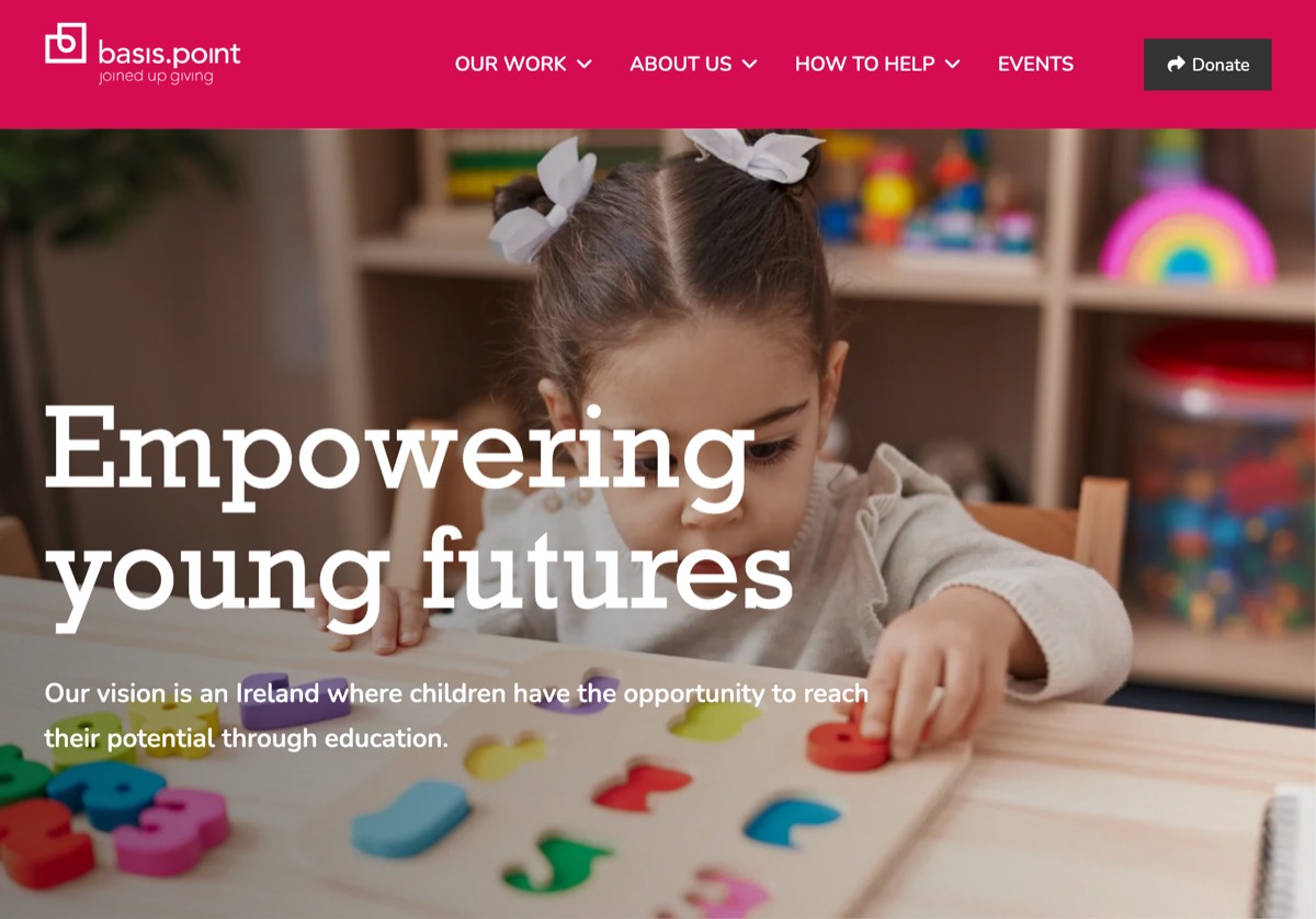 basis.point homepage, headed Empowering young futures, over a photo of a child playing with wooden letters. Shown with the volunteering page on a phone, headed Premier and Prestige Patron Volunteering Opportunities, above a button to register your interest.